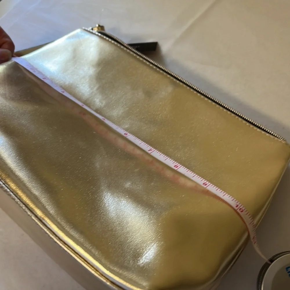 Gold Victoria’s Secret cosmetics/ small carrying bag with handle, studded heart